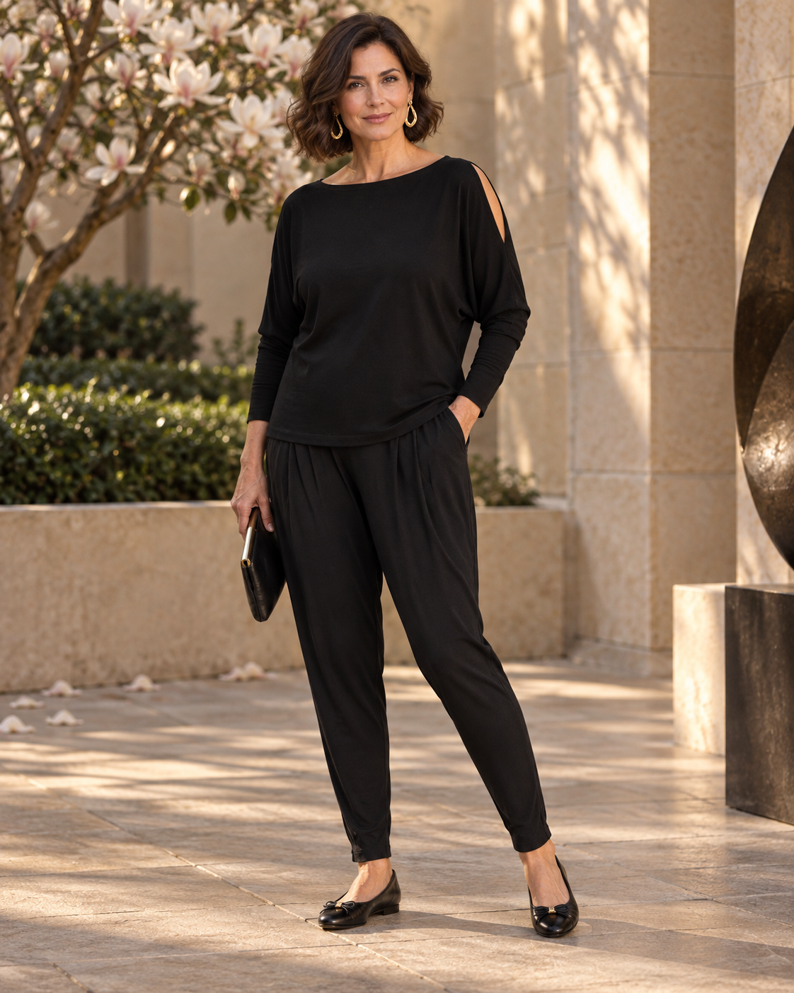 Black Basque Pant with an untucked black cold-shoulder merino top and ballet flats for evening