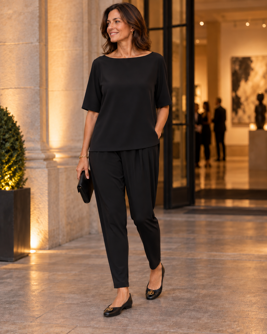 Black Basque Pant styled for evening with a loose black top and ballet flats