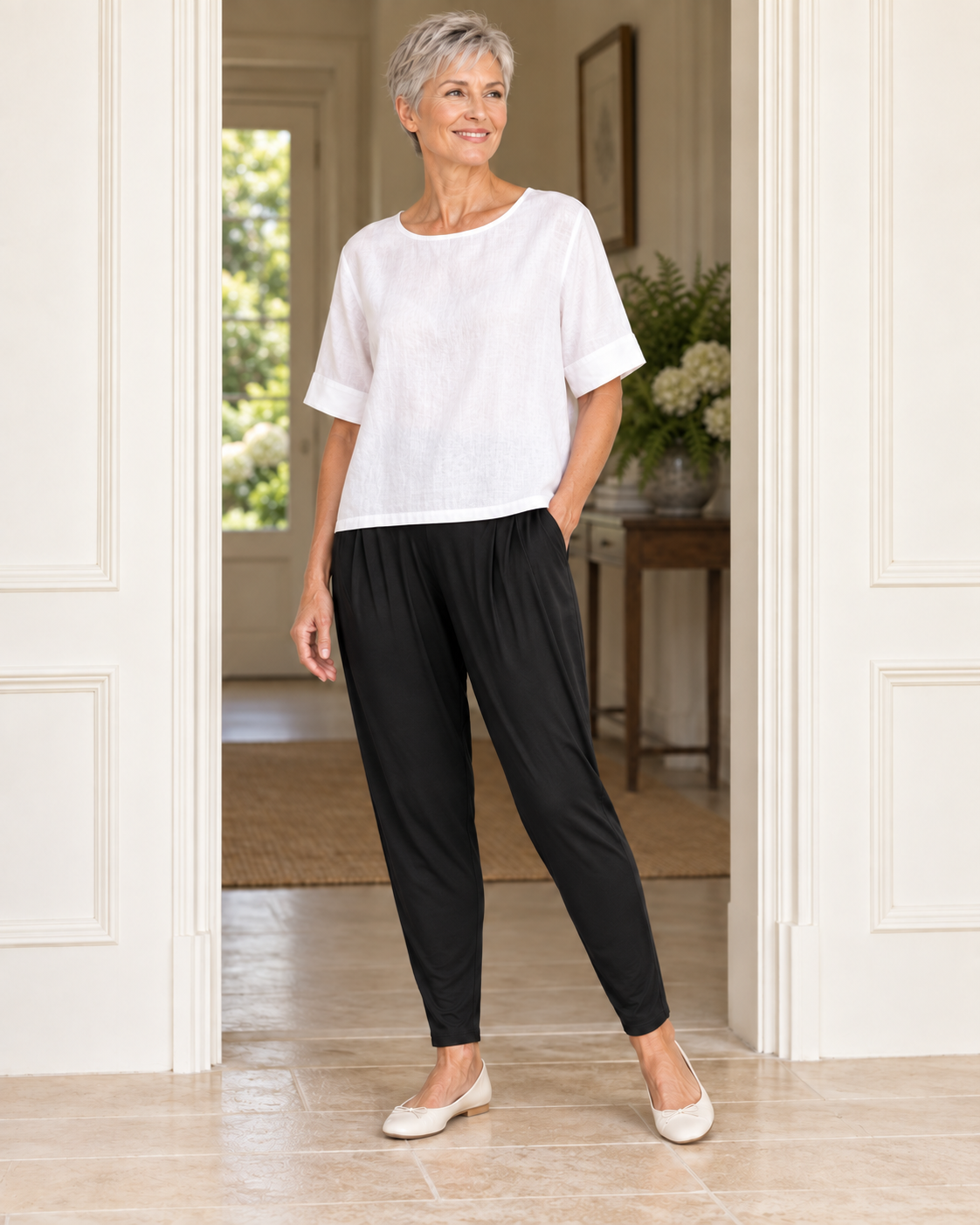 The long line of the black Basque Pant, worn with a loose white top and ballet flats